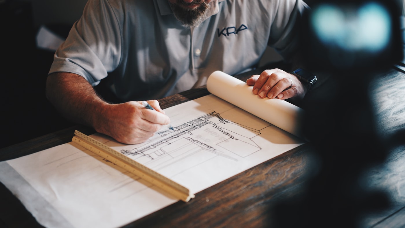 An architect working over a set of drawings